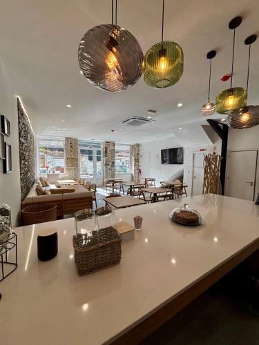 a kitchen and living room with several lights at Casa Tawny in Pinhão