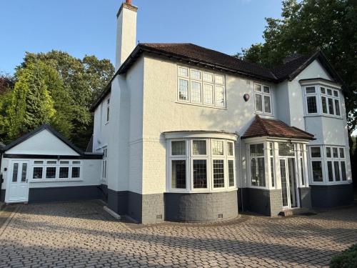 a large white house with a lot of windows at Annex Studio - Sleeps 2 High-Speed Wifi & Parking in Liverpool
