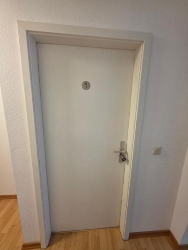 a white door with a silver door knob at Ferienwohnung Wetzlar Altstadt in Wetzlar