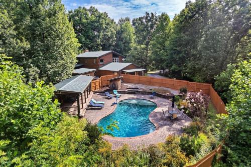 an aerial view of a house with a swimming pool at Eagles Perch Pool Cabin in Rocky Grove