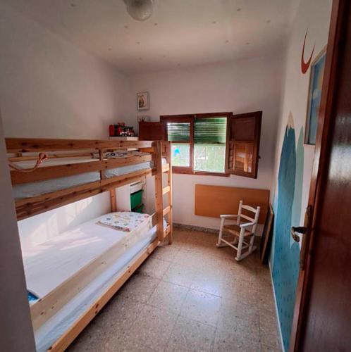 a room with two bunk beds and a chair at Buganvilla in Valencia