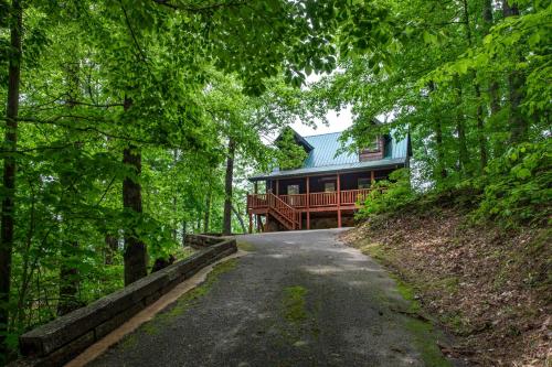 a house on a hill with a road leading to it at All Time High in Cartertown