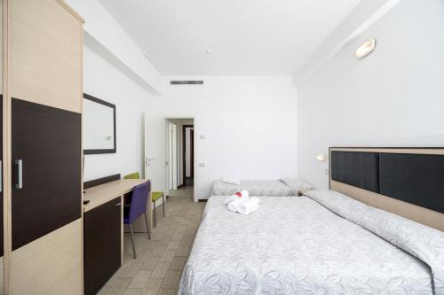 Postel nebo postele na pokoji v ubytování Hotel Marco