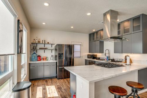 a kitchen with gray cabinets and a counter top at 2 Mi to Dtwn Home with Private Pool in Sacramento in West Sacramento