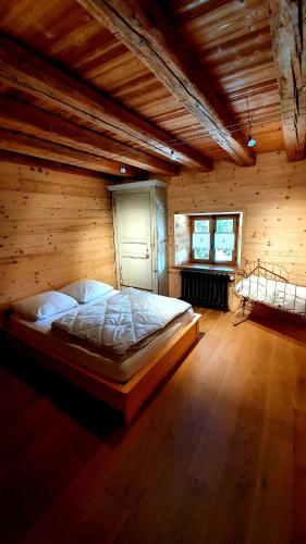 Postel nebo postele na pokoji v ubytování Au pied du tilleul