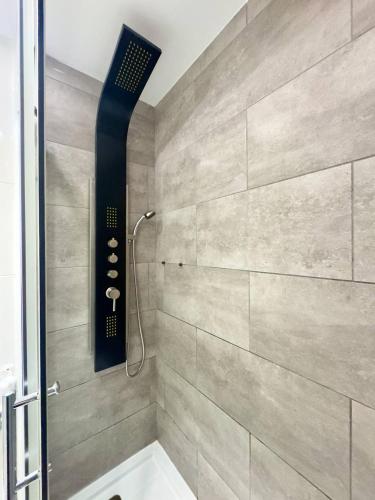 a bathroom with a shower with a shower head at El sueño de mi vida in Caleta De Fuste