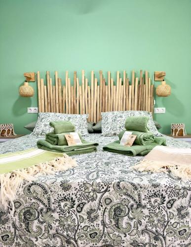 a bedroom with a bed with pillows and a radiator at El sueño de mi vida in Caleta De Fuste