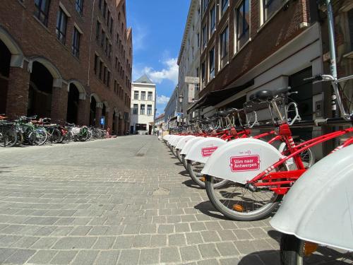 a row of bikes parked on the side of a street at Grote Markt suite 3 in Antwerp