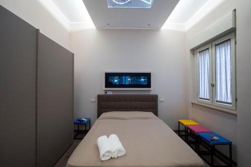 Ένα ή περισσότερα κρεβάτια σε δωμάτιο στο La Maison Des Artistes GG ART