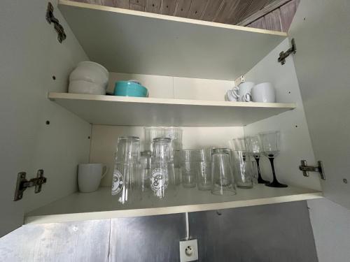 a bunch of glass jars on shelves in a kitchen at T3 Muret in Muret