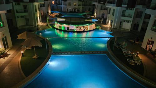 an overhead view of a swimming pool at night at Elegant Stay in Hurghada