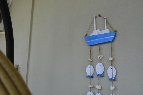 a group of four tennisoons hanging on a wall at 7th Heaven Luxury Maisonette in Kallithea Halkidikis