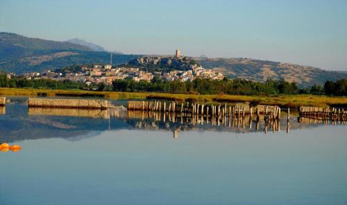 a body of water with a town in the background at Prenda Home Holiday in Posada