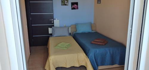 Katil atau katil-katil dalam bilik di ''Villa Popi Gouves & Spa''Maisonette