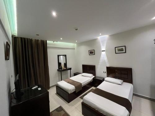 Кровать или кровати в номере New Siesta Hotel & Resort