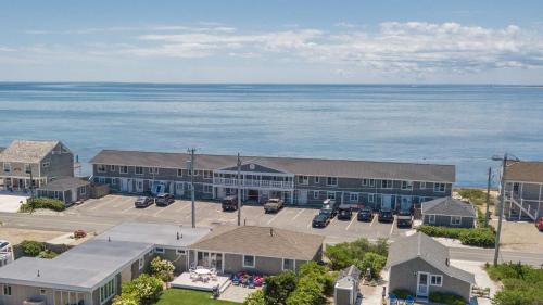 an aerial view of a building next to the water at Beachfront with Stunning Views in Truro