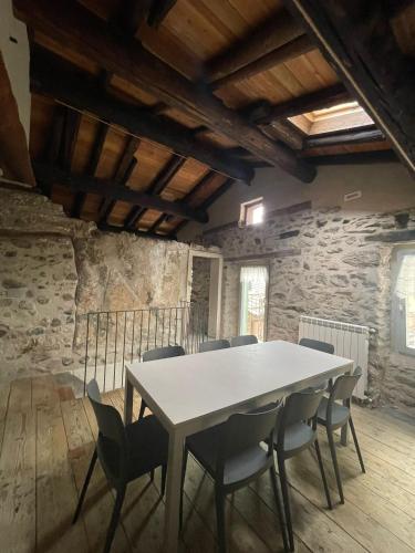 a dining room with a table and chairs at ALBERGO DIFFUSO ORNICA NEL CUORE in Ornica