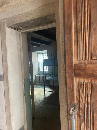a door into a room with a dining room at ALBERGO DIFFUSO ORNICA NEL CUORE in Ornica
