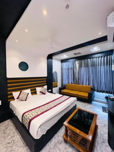 Postel nebo postele na pokoji v ubytování Hotel K Max