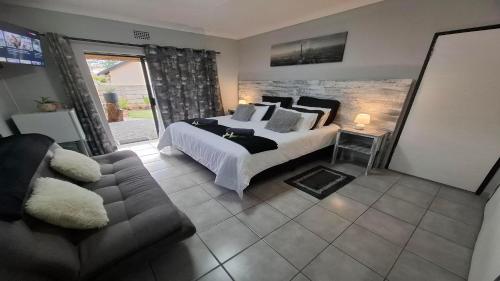 Postel nebo postele na pokoji v ubytování Villa Marais Guest House