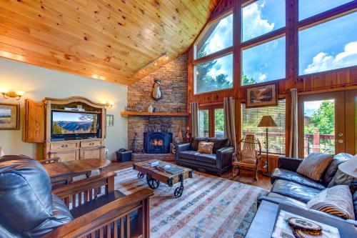 a living room with a couch and a fireplace at A Mountain Dream in Rocky Grove