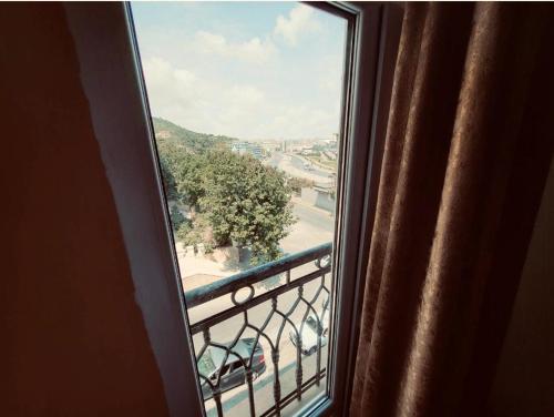 a window of a room with a view of a street at ZamZam-Madinah Halal Hotels Group in Baku