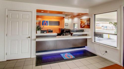 a large waiting room with a barbershop with a waiting room at Manteca, CA in Manteca