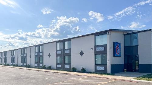 an empty parking lot in front of a building at Motel 6 Rockford, IL – RFD Airport in Rockford