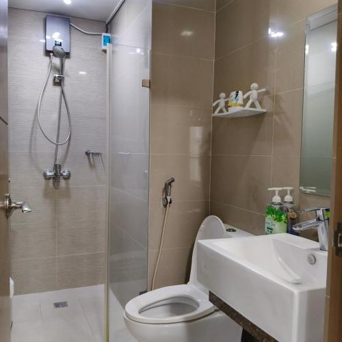 a bathroom with a shower and a toilet and a sink at LDN Secret Crib 6E -Two Palm Tree in Manila