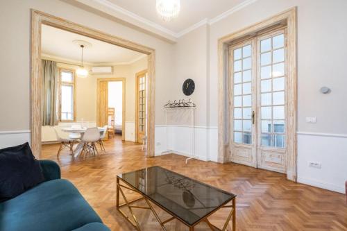 a living room with a couch and a table at Lascăr Catargiu Villa in Bucharest