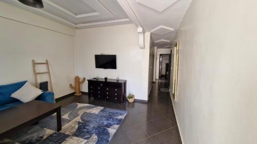 TV a/nebo společenská místnost v ubytování Appartement proche du centre