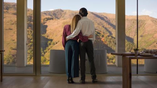 a man and a woman looking out of a window at Arantza Hotela - Boutique Hotel "Adults Only" in Arantza