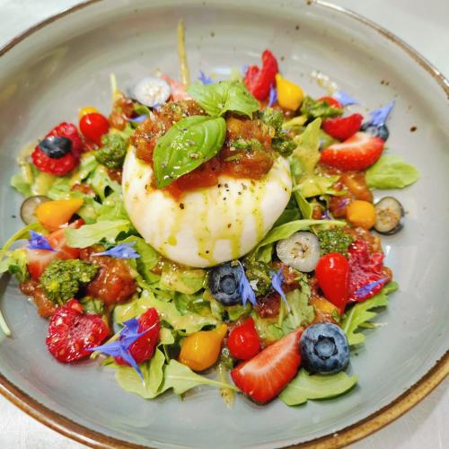 a plate of food with a salad with eggs on it at Osada Prado in Michałkowa