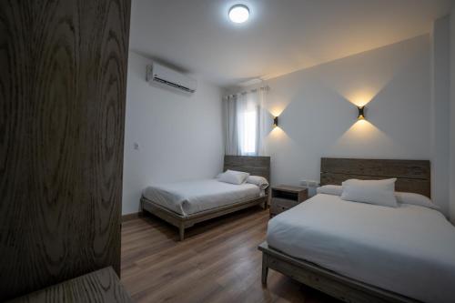 Ένα ή περισσότερα κρεβάτια σε δωμάτιο στο Stayr Somabay - Bay Life Home Rentals