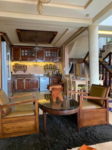 a kitchen with a table and chairs in a room at Riad eSSAOUIRA View in Essaouira