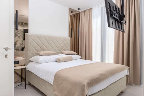 a bedroom with a bed with a large window at Samstag ParkZone in Split