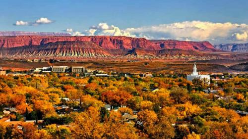 a city with fall trees and a mountain in the background at Ridge House - Two Pools Near Zion in Washington