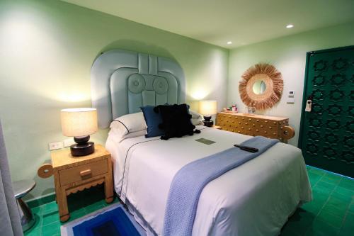 Una cama o camas en una habitación de William Hotel Boutique De Diseño