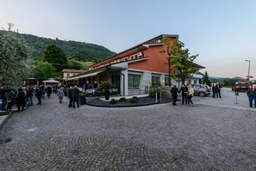 a group of people standing outside of a building at Hotel Ristorante La Rosina in Marostica