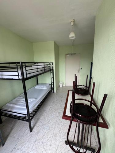 Postel nebo postele na pokoji v ubytování Hostel Wilson