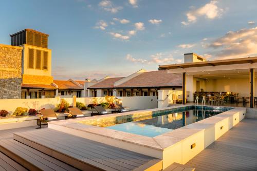 an image of a house with a swimming pool at Steyn City Hotel by Saxon in Midrand