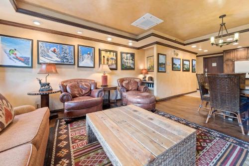 a living room with a couch and chairs and a table at Lodge Tower 494 One Bedroom Residence in Vail