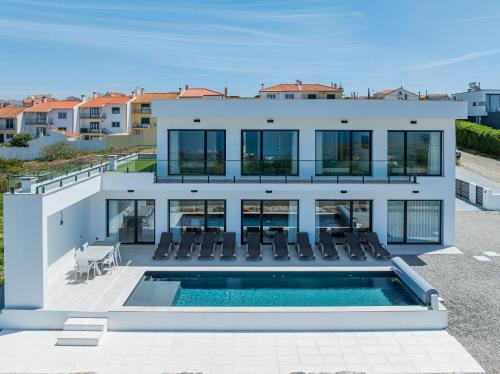 an aerial view of a house with a swimming pool at Axess Villa with panoramic ocean view in Lourinhã