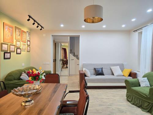 a living room with a table and a couch at Summer House with Private Pool in K'obulet'i