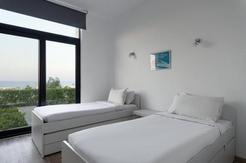 Ένα ή περισσότερα κρεβάτια σε δωμάτιο στο Stayr Somabay - Bay Life Home Rentals