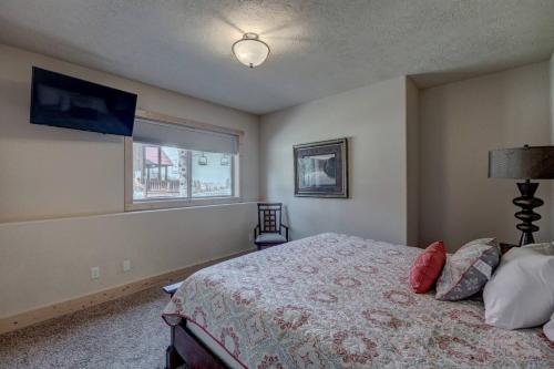 a bedroom with a bed and a window at Holy Terror Chalet At Terry Peak Ski Resort in Lead