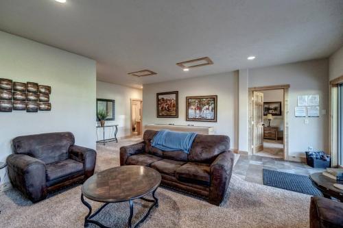 a living room with two couches and a table at Holy Terror Chalet At Terry Peak Ski Resort in Lead