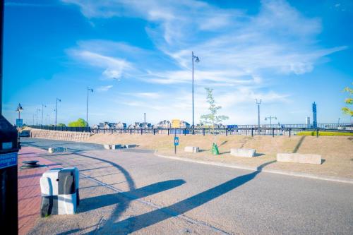 a parking lot with a parking meter on the street at Cosy 5 Bedroom House With Parking in Chatham