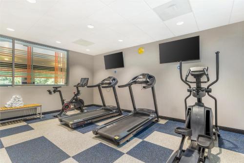 a gym with three exercise bikes in a room at Best Western Asheville-Blue Ridge Parkway in Asheville