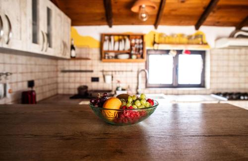 a bowl of fruit sitting on a counter in a kitchen at Casa in The Clouds in Genovés